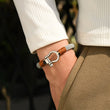 Load image into Gallery viewer, Omega gray nautical bracelet on model&#39;s wrist.

