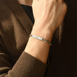 Load image into Gallery viewer, Silver bracelet with name engraving on male model
