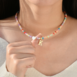 Load image into Gallery viewer, Female Model wearing the letter K &quot;To My Granddaughter, Keep Me In Your Heart Personalized Colorful Beads Choker&quot; 
