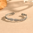 Load image into Gallery viewer, Hug From Heaven Angel Wings Vintage Style Bracelet in creative shot
