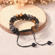 Load image into Gallery viewer, Lifestyle image of Triple Protection Bracelet on thin log
