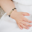 Load image into Gallery viewer, Black Knot Bracelet worn by a child
