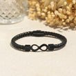Load image into Gallery viewer, Creative image of the Infinity braided bracelet on canvas

