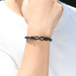 Load image into Gallery viewer, Infinity braided bracelet on male model wrist
