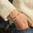Load image into Gallery viewer, Model wearing the To My Granddaughter, Always In My Heart Peach Blossom Knot Bracelet
