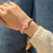 Load image into Gallery viewer, Female model wearing the peach blossom Knot Bracelet
