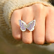 Load image into Gallery viewer, Female model wearing the purple variant of Double butterfly ring

