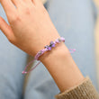 Load image into Gallery viewer, Model wearing purple variant of Purple variant of Butterfly Charm Bracelet
