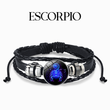 Load image into Gallery viewer, Pulsera del signo del zodíaco escorpio sobre fondo blanco.
