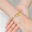 Load image into Gallery viewer, model wearing gold To My Daughter, Always In My Heart Personalized Initial In Knot Bracelet
