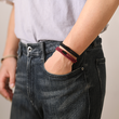 Load image into Gallery viewer, Black and Wine Red Double Layer Bracelet on a model&#39;s hand.
