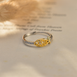 Load image into Gallery viewer, Faith, Hope and Love Ichthus Adjustable Ring on top of a book.
