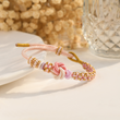 Load image into Gallery viewer, Peach Blossom Knot Bracelet lifestyle shot
