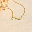 Load image into Gallery viewer, Personalized Infinity Necklace on a beige canvass

