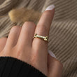 Load image into Gallery viewer, model wearing the gold dog bone ring
