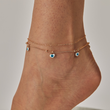 Load image into Gallery viewer, A model wearing Blue Heart Evil Eye Gold Chain Ankle Bracelet
