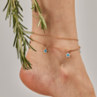 Load image into Gallery viewer, A model wearing Blue Star Evil Eye Gold Chain Ankle Bracelet
