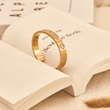 Load image into Gallery viewer, Evil Eye White Stones Gold Bangle in a book
