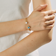 Load image into Gallery viewer, A model wearing Heart &amp; Pearl Evil Eye Bangle
