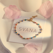 Load image into Gallery viewer, Multicolored Evil Eye Ankle Bracelet on top of a SVANA Design card
