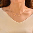 Load image into Gallery viewer, Woman wearing gold necklace with initials
