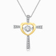 Load image into Gallery viewer, A closer look of a cross and heart pendant 
