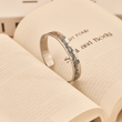 Load image into Gallery viewer, I Am So Proud of You Love Dad Bracelet placed at the middle of a book page
