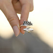 Load image into Gallery viewer, Silver plated dragon adjustable ring being held by a model with blurry background
