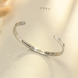 Load image into Gallery viewer, I Love You Mom bracelet on an open book

