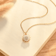 Load image into Gallery viewer, To My Daughter Sunflower Fidget Necklace on top of an open book
