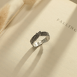 Load image into Gallery viewer, Personalized Angel Wing Ring on an open book
