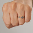 Load image into Gallery viewer, Love + Faith Heart &amp; Cross Ring worn on the ring finger by a model with a closed fist
