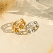 Load image into Gallery viewer, Gold and Silver To My Daughter, Personalized Roman Numerals Rings on a paper background
