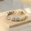 Load image into Gallery viewer, Creative shot of a Picasso Jasper Name Bracelet
