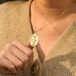 Load image into Gallery viewer, Model wearing and holding Dainty Virgin Mary Necklace
