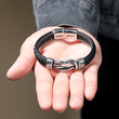 Load image into Gallery viewer, To My Son, Together Forever Knot Bracelet on a model&#39;s open hand
