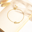 Load image into Gallery viewer, To My Granddaughter Custom Name Ankle gold Bracelet placed on the top of a book
