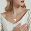 Load image into Gallery viewer, model wearing paw prints necklace
