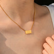 Load image into Gallery viewer, a model wearing 999 angel number pendant gold necklace

