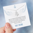 Load image into Gallery viewer, Friendship Anchor Necklace on a page of an open book

