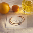 Load image into Gallery viewer, Almond Shaped Evil Eye Beaded Bangle on top of a SVANA Design Card
