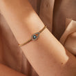 Load image into Gallery viewer, A model wearing Almond Shaped Evil Eye Beaded Bangle
