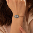 Load image into Gallery viewer, A model wearing Ancient Protector Evil Eye Gold Tone Bracelet
