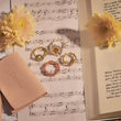 Load image into Gallery viewer, four pieces sunflower adjustable rings placed on top of a note sheet
