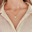 Load image into Gallery viewer, Moon and Shine Gold Coin Necklace on the neck of a model
