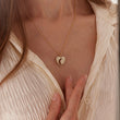 Load image into Gallery viewer, Moon and Heart Gold Necklace worn by a female model

