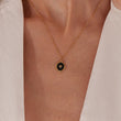 Load image into Gallery viewer, Oval Star of David Black Gold Necklace worn on the neck by a female model
