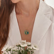 Load image into Gallery viewer, Round Tree of Life Emerald Necklace in white background worn by a female model

