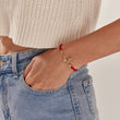 Load image into Gallery viewer, Adjustable butterfly string bracelet being worn by a model
