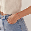 Load image into Gallery viewer, Infinity Red String Bracelet worn by a female model on her left wrist
